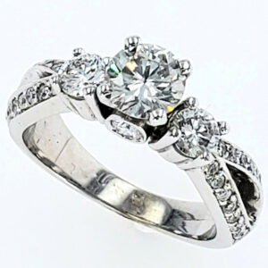 14K White Gold three round stone ring in a twisted band with pavé set round diamond