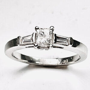 Platinum 3 stones princess prong set center stone & 2 Baguettes side stones